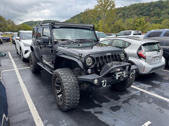used 2014 Jeep Wrangler Unlimited car, priced at $18,997