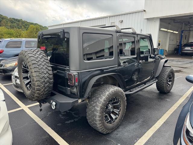 used 2014 Jeep Wrangler Unlimited car, priced at $18,997