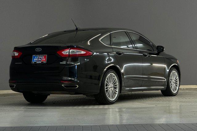 used 2014 Ford Fusion car, priced at $7,599