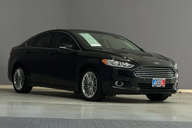 used 2014 Ford Fusion car, priced at $7,599