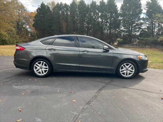 used 2016 Ford Fusion car, priced at $4,900