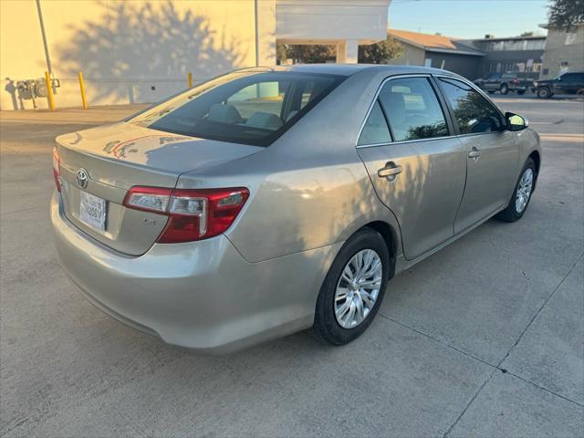 used 2014 Toyota Camry car, priced at $9,999