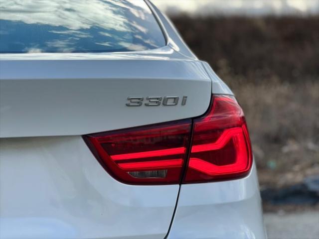 used 2018 BMW 330 car, priced at $18,287