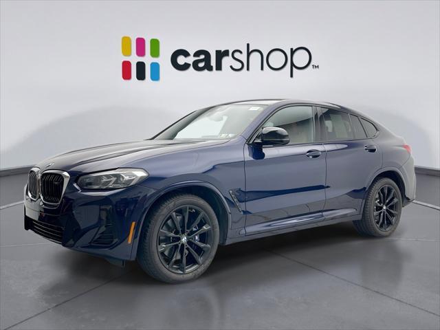 used 2023 BMW X4 car, priced at $50,000