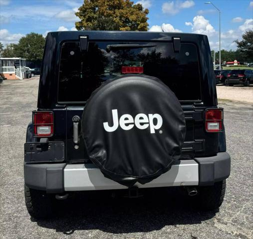 used 2013 Jeep Wrangler Unlimited car, priced at $13,999