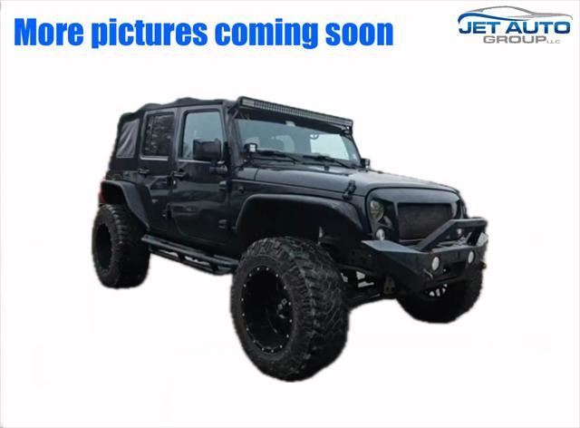 used 2014 Jeep Wrangler Unlimited car, priced at $19,477