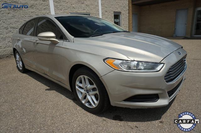 used 2016 Ford Fusion car, priced at $4,977
