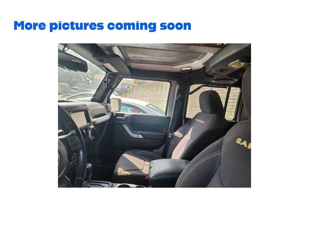 used 2013 Jeep Wrangler Unlimited car, priced at $9,977