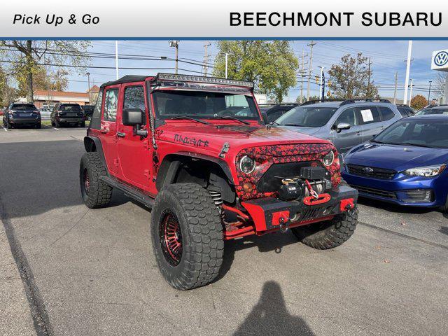 used 2011 Jeep Wrangler Unlimited car, priced at $13,496