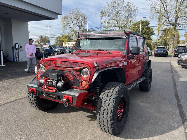 used 2011 Jeep Wrangler Unlimited car, priced at $13,496