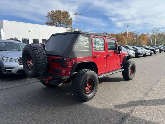 used 2011 Jeep Wrangler Unlimited car, priced at $13,496