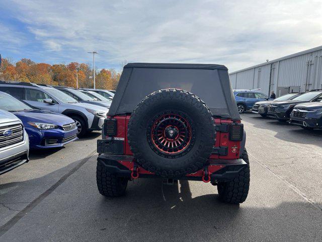 used 2011 Jeep Wrangler Unlimited car, priced at $13,496