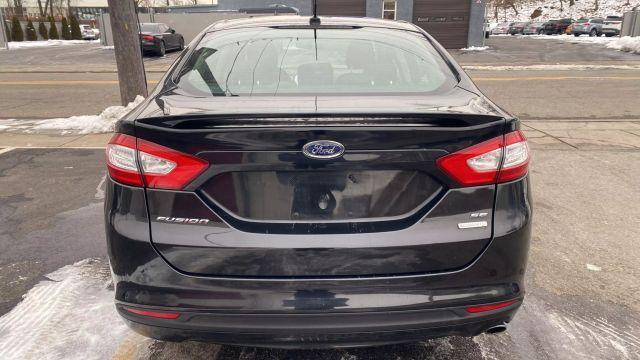 used 2014 Ford Fusion car, priced at $9,999