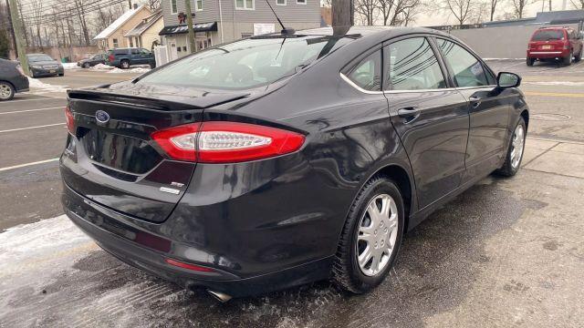 used 2014 Ford Fusion car, priced at $9,999