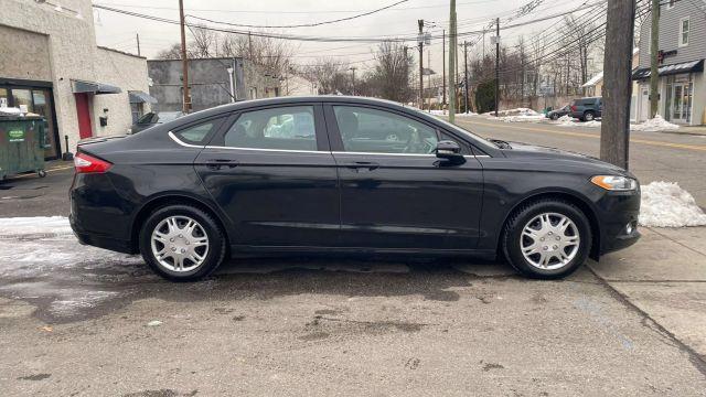 used 2014 Ford Fusion car, priced at $9,999