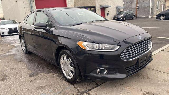 used 2014 Ford Fusion car, priced at $9,999