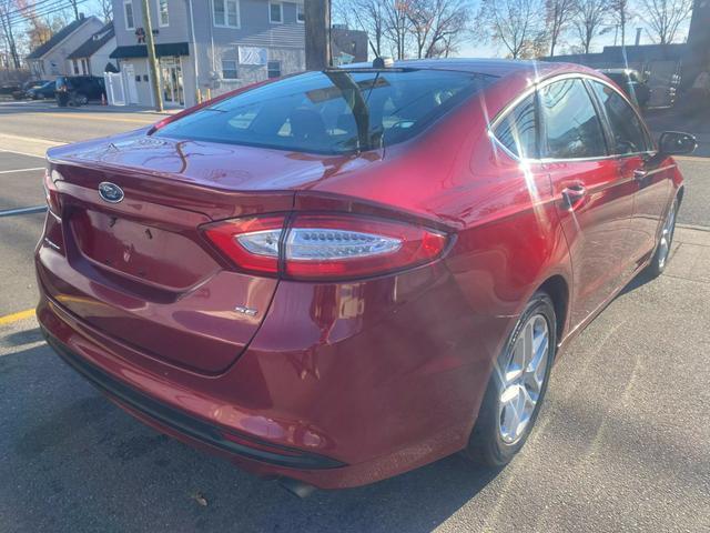 used 2016 Ford Fusion car, priced at $7,999