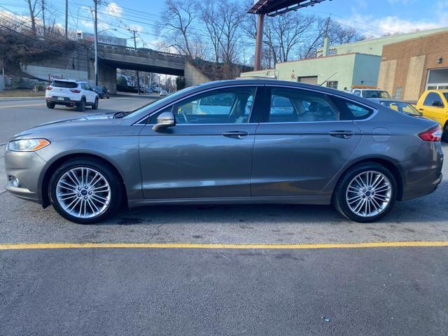 used 2014 Ford Fusion car, priced at $5,999