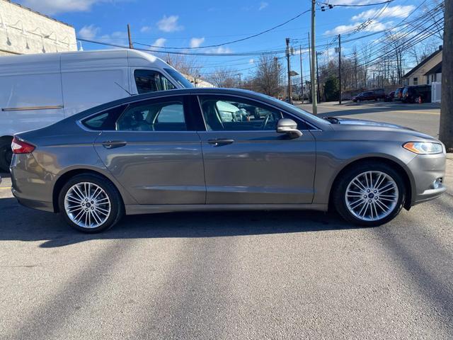 used 2014 Ford Fusion car, priced at $5,999