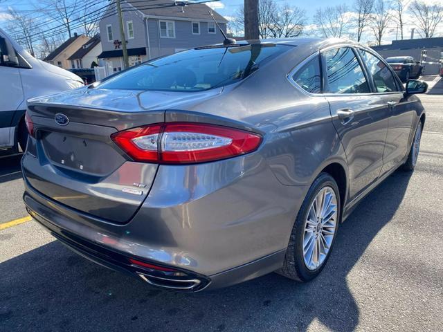 used 2014 Ford Fusion car, priced at $5,999