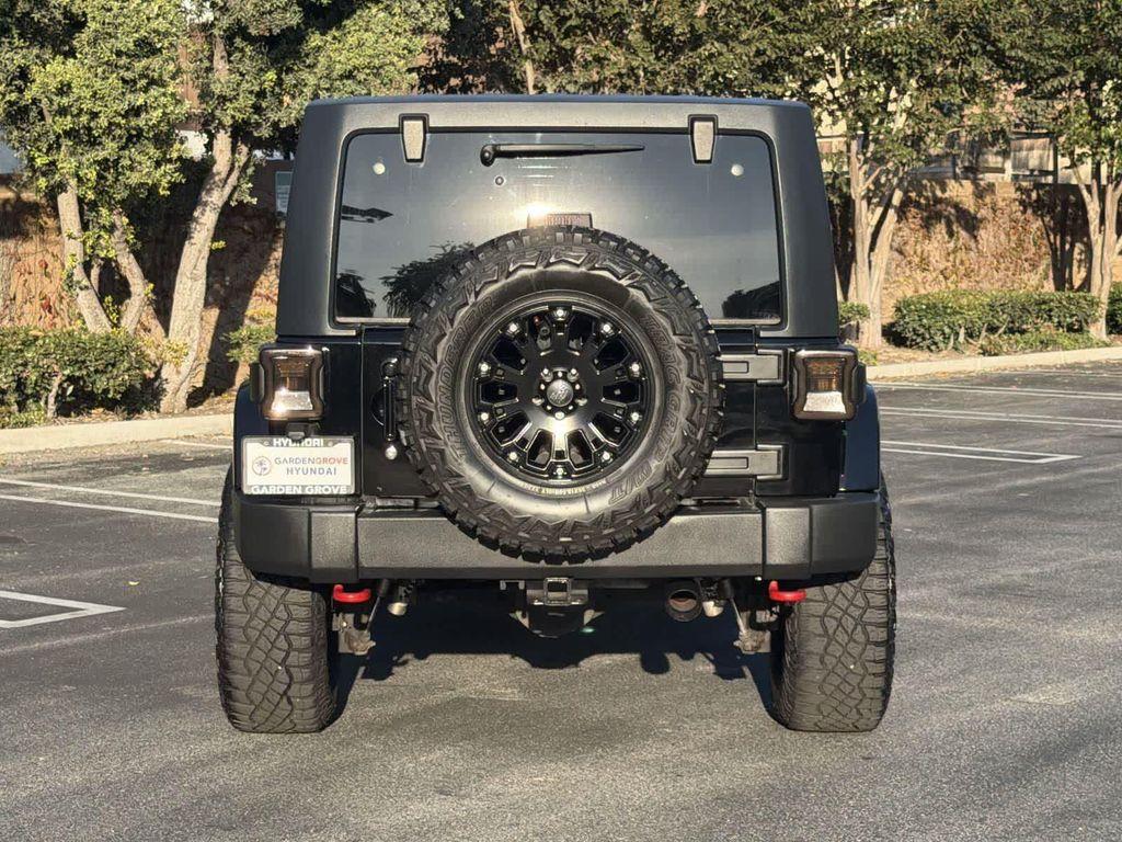 used 2014 Jeep Wrangler Unlimited car, priced at $18,928