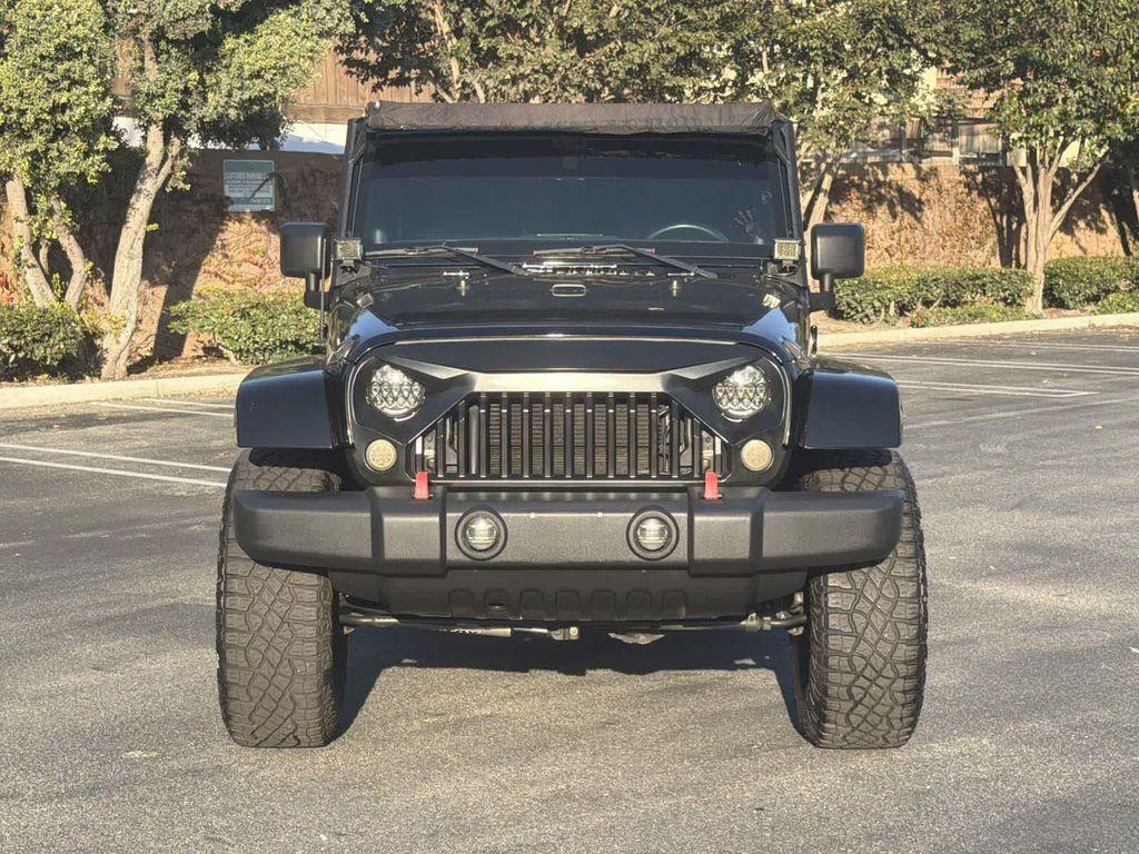 used 2014 Jeep Wrangler Unlimited car, priced at $18,928