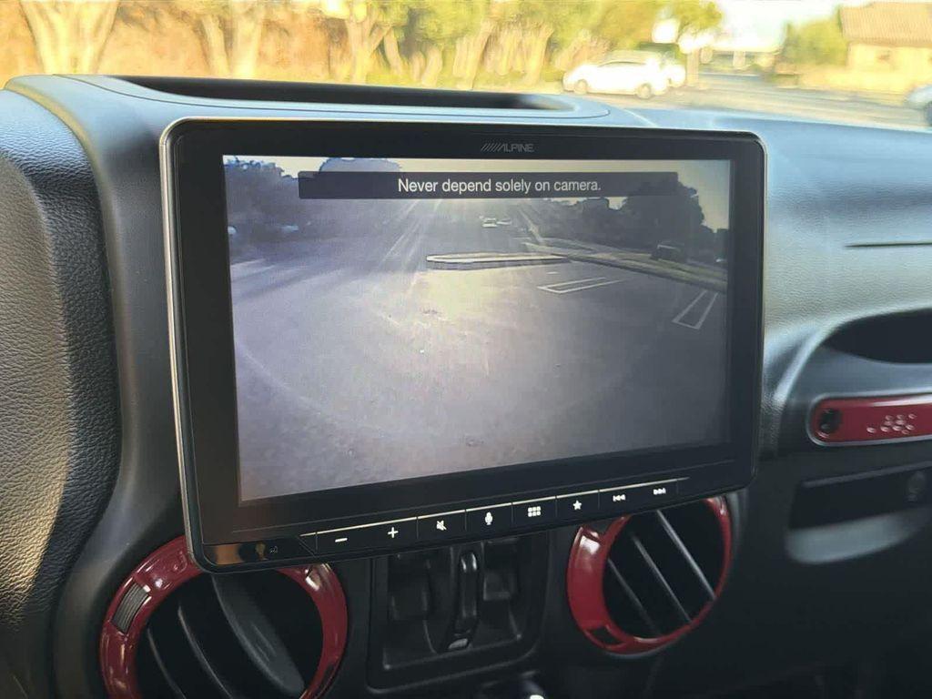 used 2014 Jeep Wrangler Unlimited car, priced at $18,928