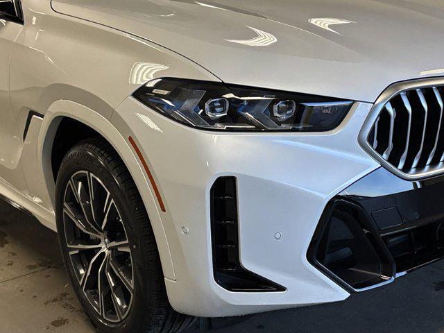 new 2025 BMW X6 car, priced at $77,875