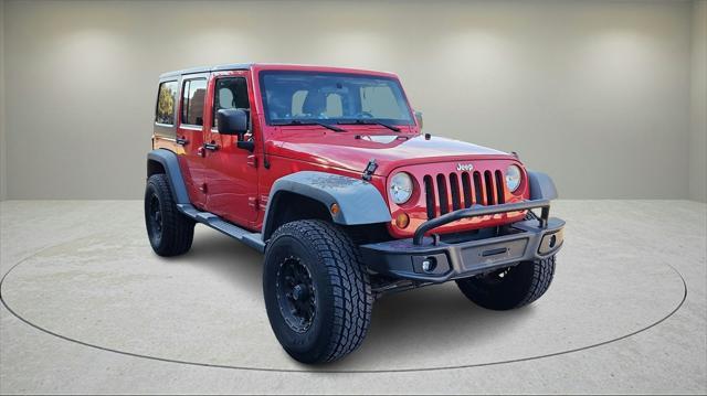 used 2011 Jeep Wrangler Unlimited car, priced at $13,021