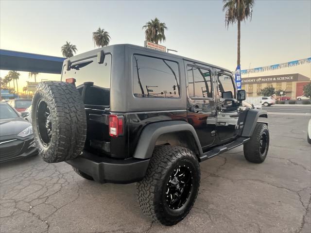 used 2014 Jeep Wrangler Unlimited car, priced at $16,995