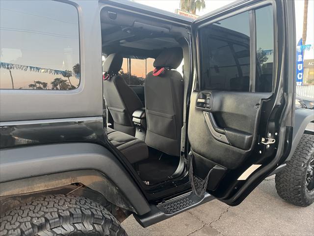 used 2014 Jeep Wrangler Unlimited car, priced at $16,995