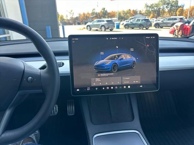 used 2023 Tesla Model 3 car, priced at $32,621