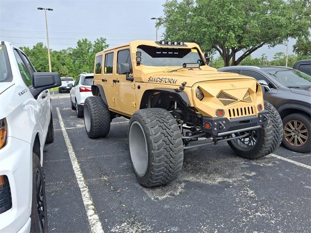 used 2013 Jeep Wrangler Unlimited car, priced at $17,977