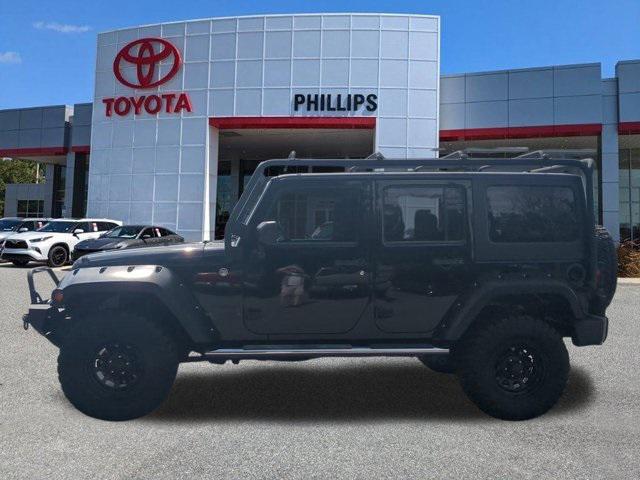 used 2014 Jeep Wrangler Unlimited car, priced at $19,997