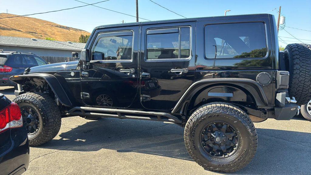 used 2011 Jeep Wrangler Unlimited car, priced at $12,999