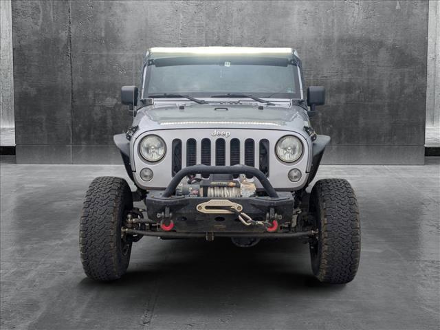 used 2014 Jeep Wrangler Unlimited car, priced at $15,649