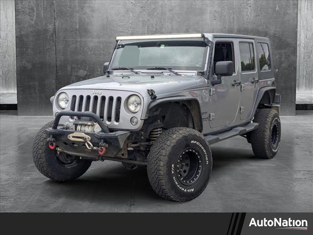 used 2014 Jeep Wrangler Unlimited car, priced at $15,649
