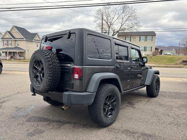 used 2014 Jeep Wrangler Unlimited car, priced at $18,815