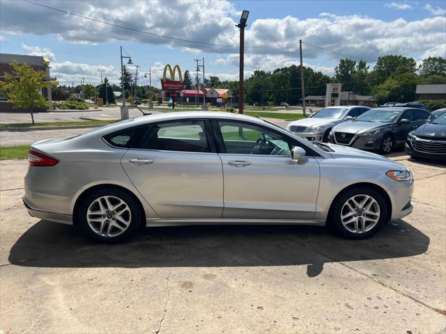 used 2014 Ford Fusion car, priced at $6,998