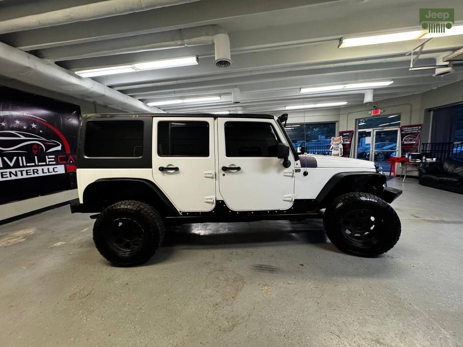used 2014 Jeep Wrangler Unlimited car, priced at $13,850