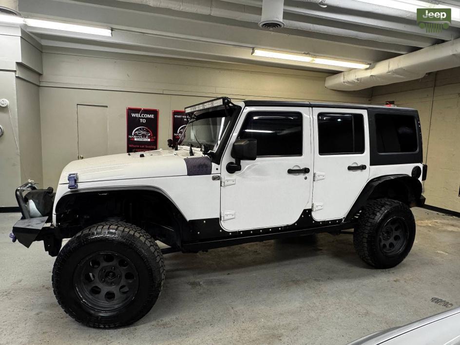 used 2014 Jeep Wrangler Unlimited car, priced at $13,850