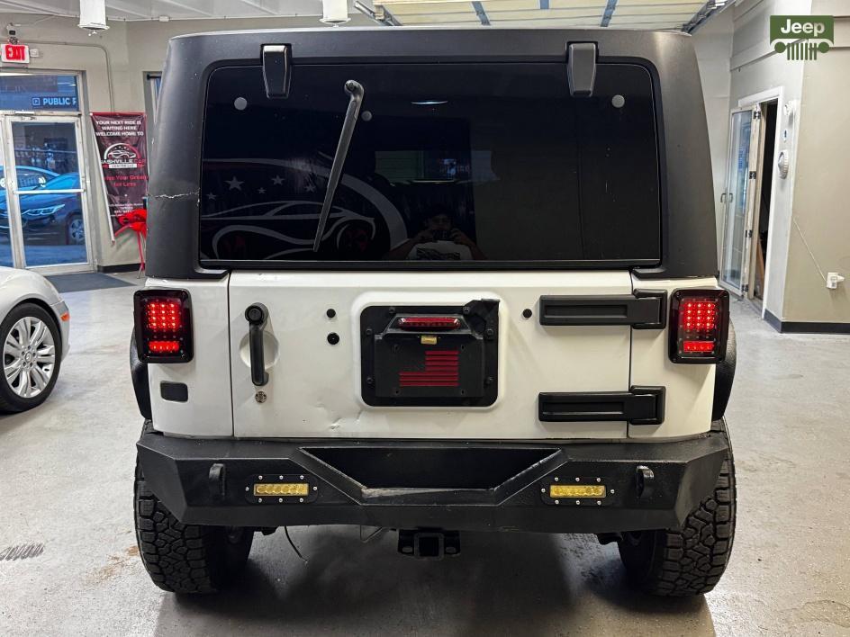 used 2014 Jeep Wrangler Unlimited car, priced at $13,850