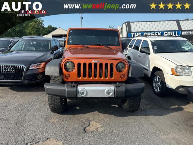 used 2011 Jeep Wrangler Unlimited car, priced at $13,995