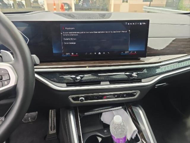 used 2025 BMW X6 car, priced at $63,450
