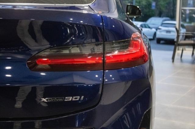 used 2022 BMW X4 car, priced at $34,135