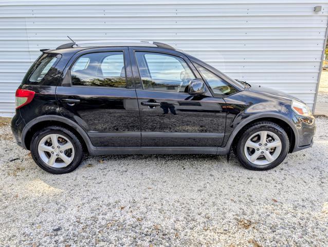 used 2009 Suzuki SX4 car, priced at $7,900