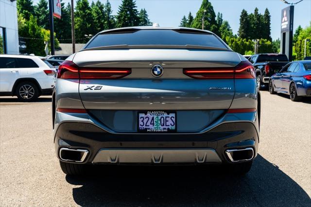 used 2024 BMW X6 car, priced at $65,973