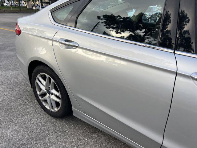used 2016 Ford Fusion car, priced at $8,999