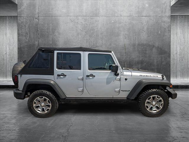 used 2014 Jeep Wrangler Unlimited car, priced at $23,154