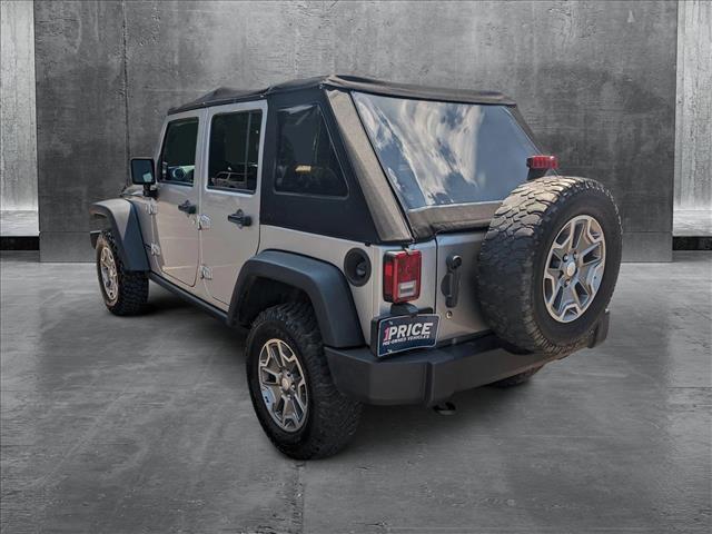 used 2014 Jeep Wrangler Unlimited car, priced at $23,154